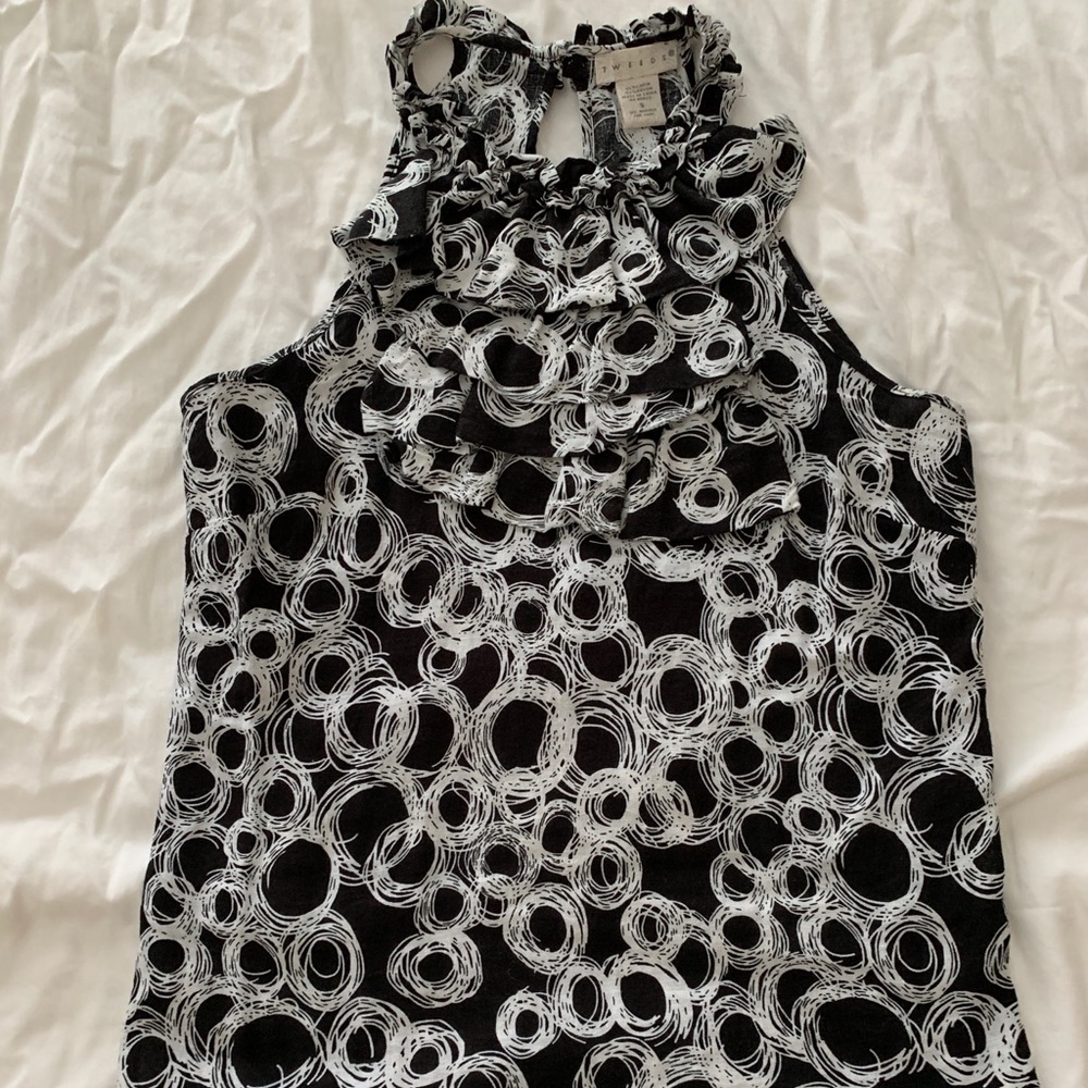 Sleeveless blouse with ruffles at the top